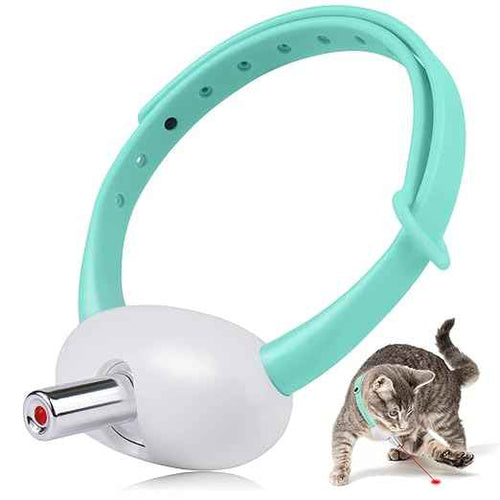 A pet laser pointer toy with a mint green adjustable silicone strap and a white cylindrical body, shown alongside a small cat chasing a red laser dot on a white background.