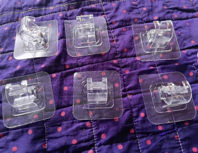 Six clear sewing machine presser feet on a purple fabric background with red polka dots.
