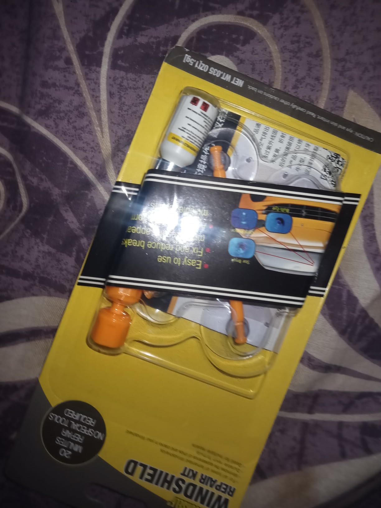 Minoshield ear protection device on a yellow card with branding and text.